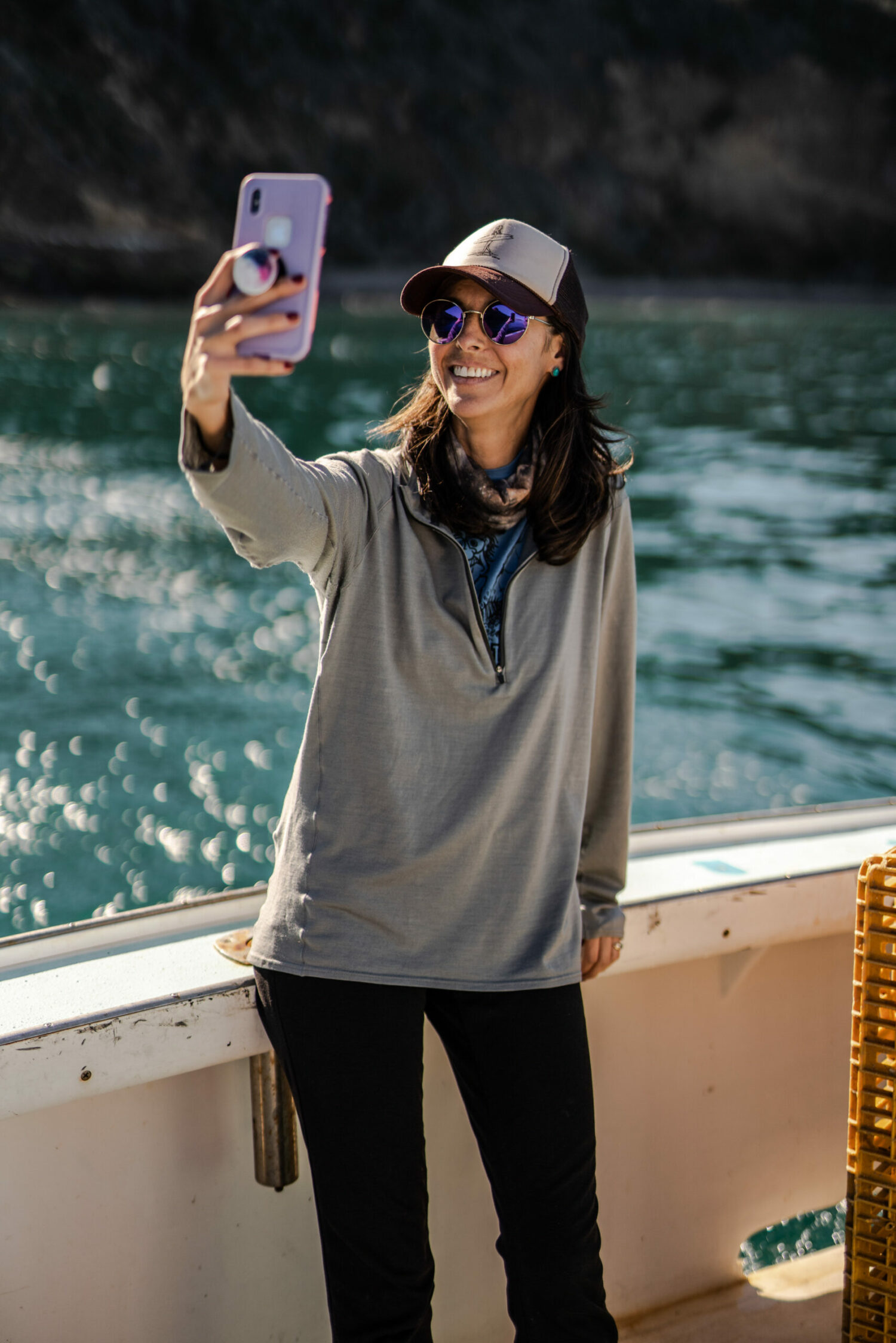Writer and partner of a commercial fisherman Megan Waldrep taking a selfie on a fishing boat