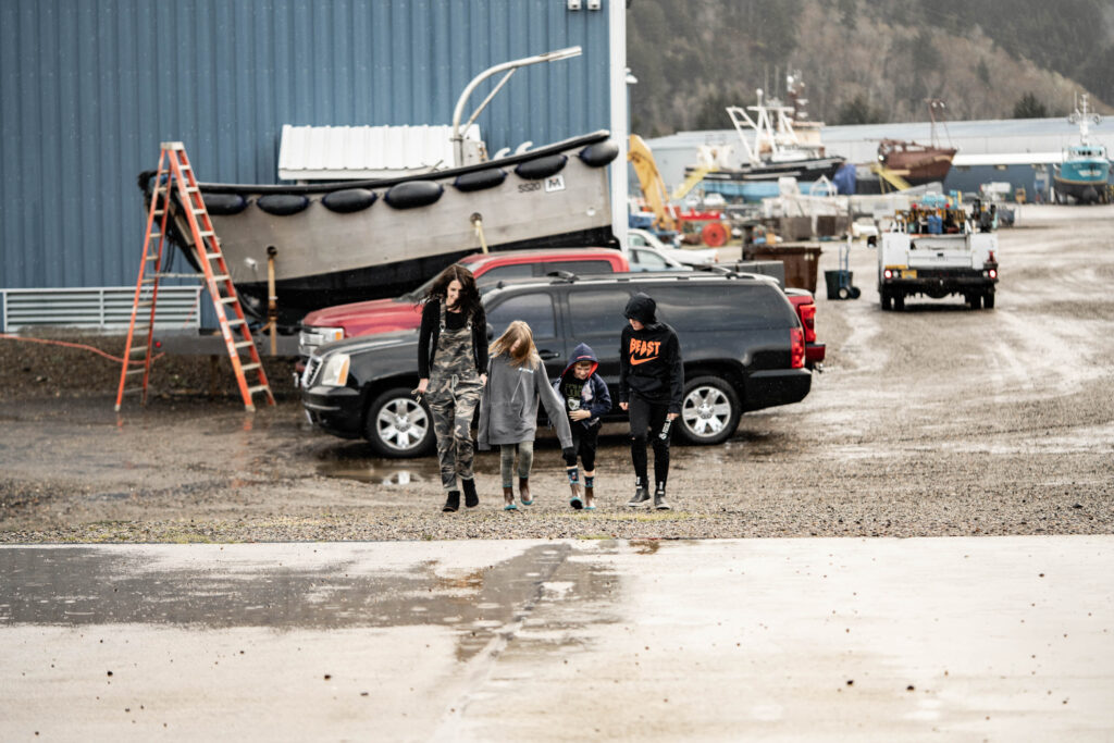 Commercial fishing mom and three kids in a commercial fishing boat yard