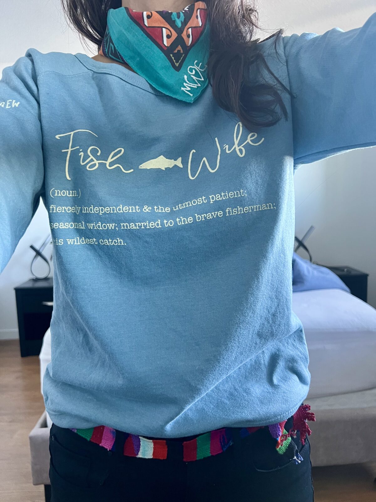 woman wearing a Fish Wife sweatshirt