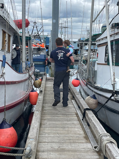 Commercial Fisherman and daughter walking the docks AMSEA Training Coordinator Ashley Green