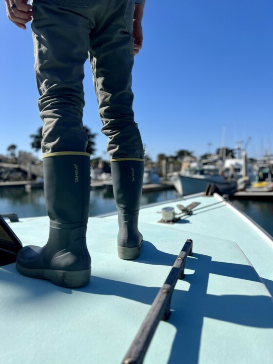 Commercial Spiny Lobster Fisherman wearing Tahma Grip Tech Boots on the bow of a boat in California